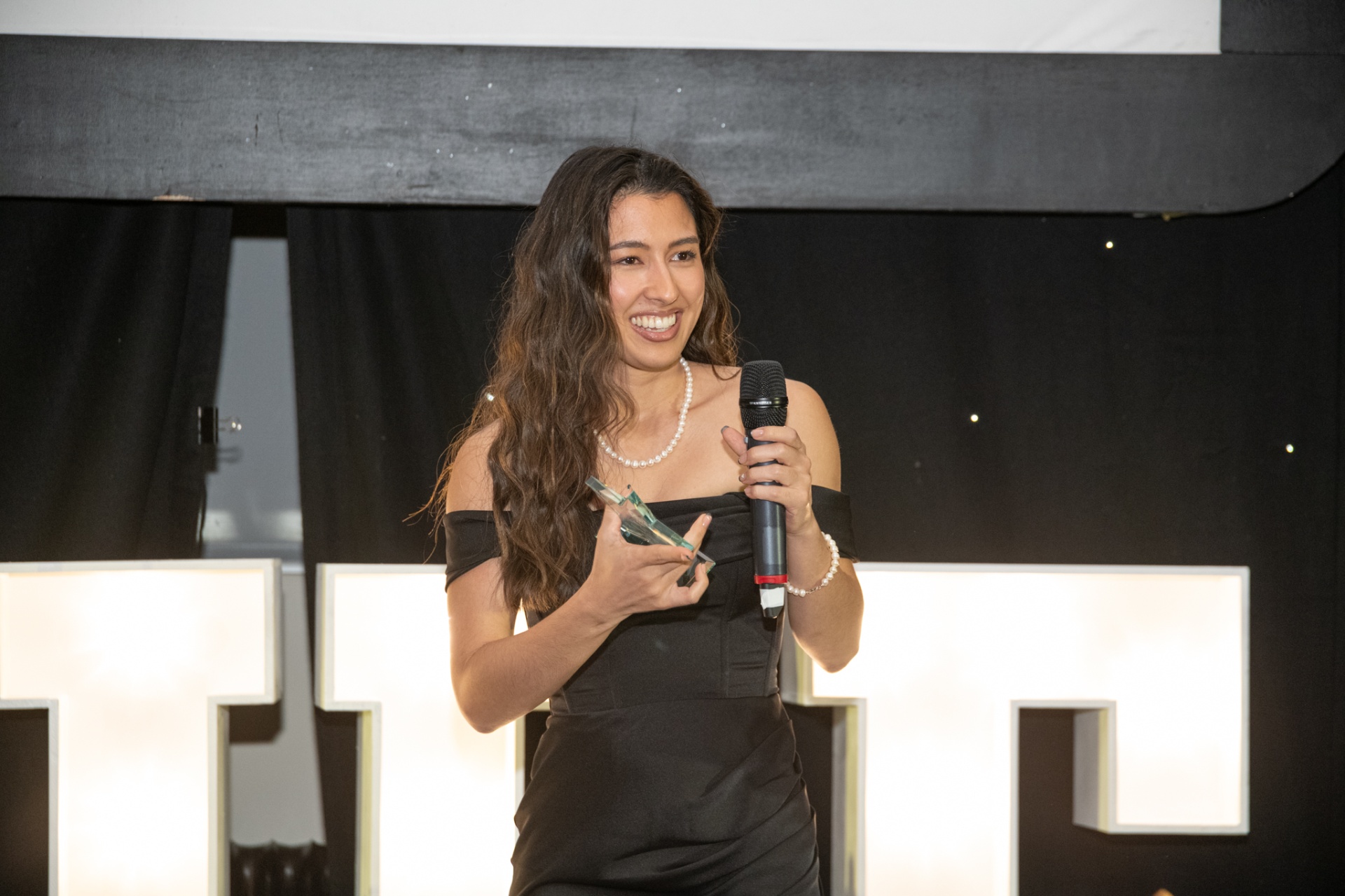 Angelica Sacrepaye accepting the Aspire Property Award 2024