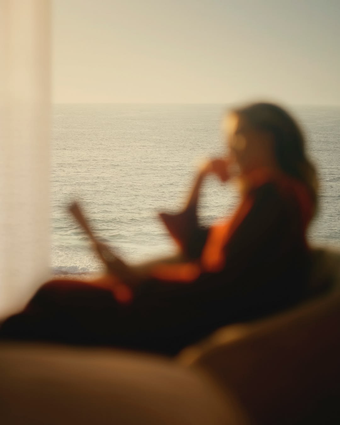 A quiet moment by the sea — life continuing while capital builds in the background